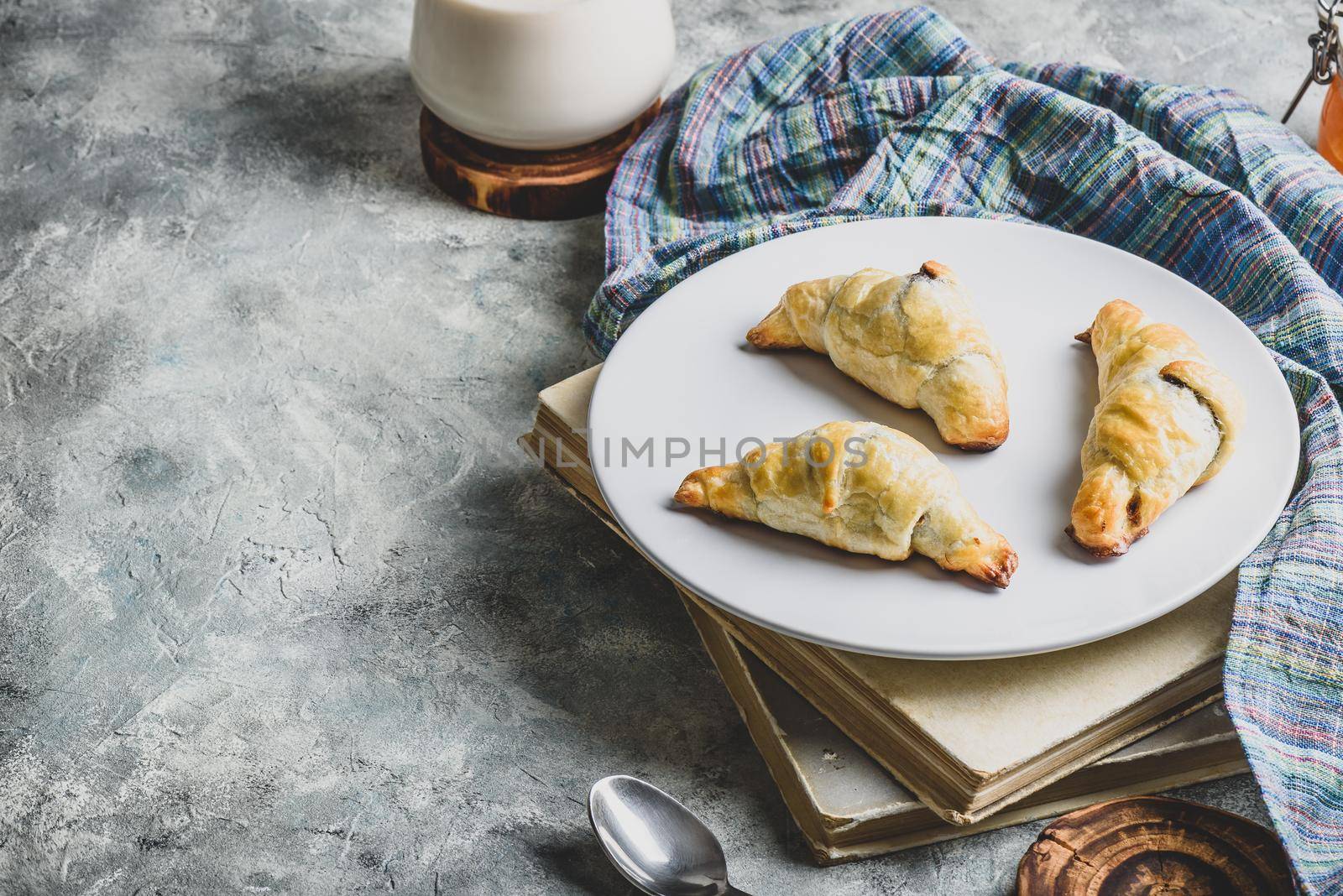 Croissants stuffed with nuts and chocolate for breakfast by Seva_blsv