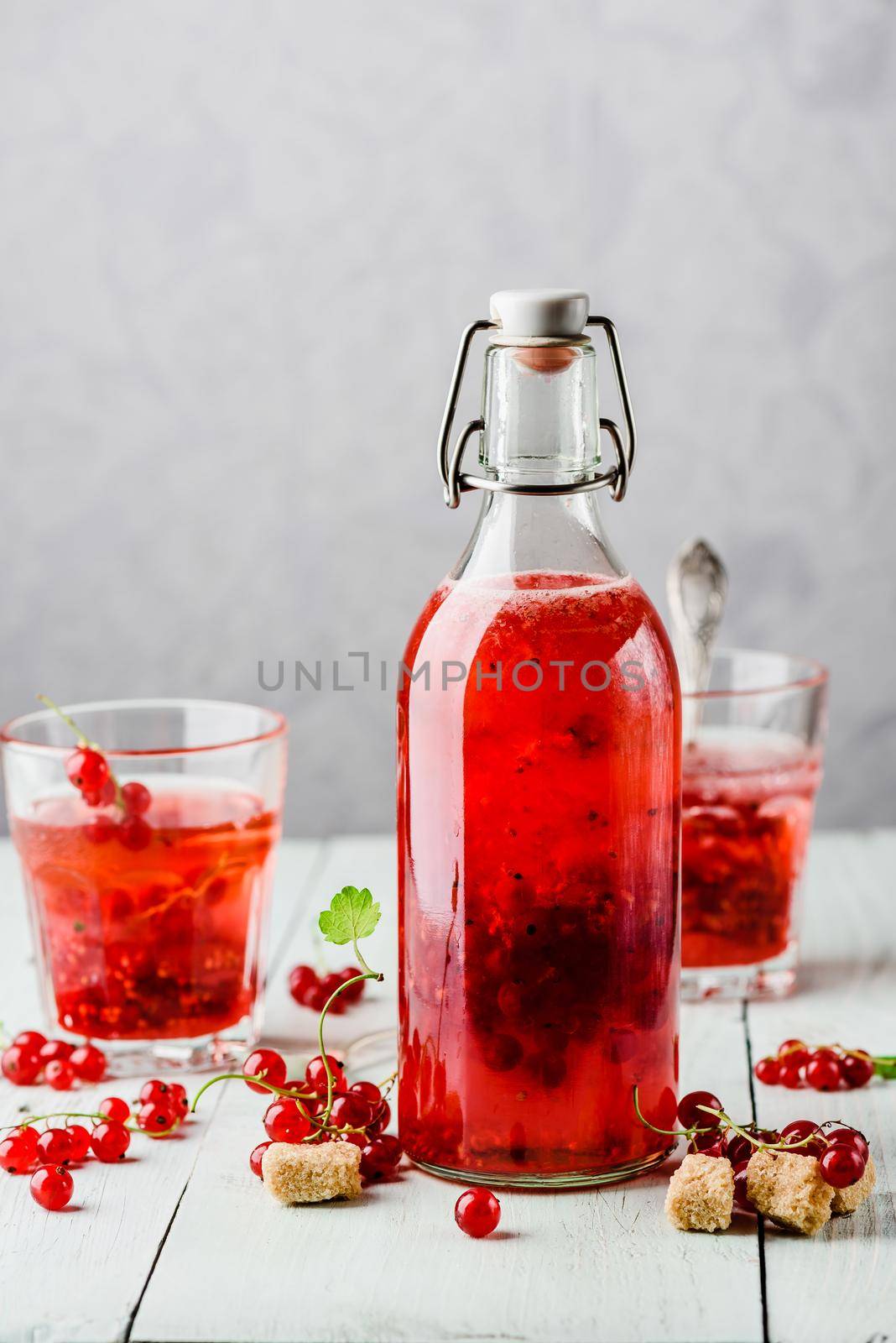 Infused water with fresh red currant and cane sugar