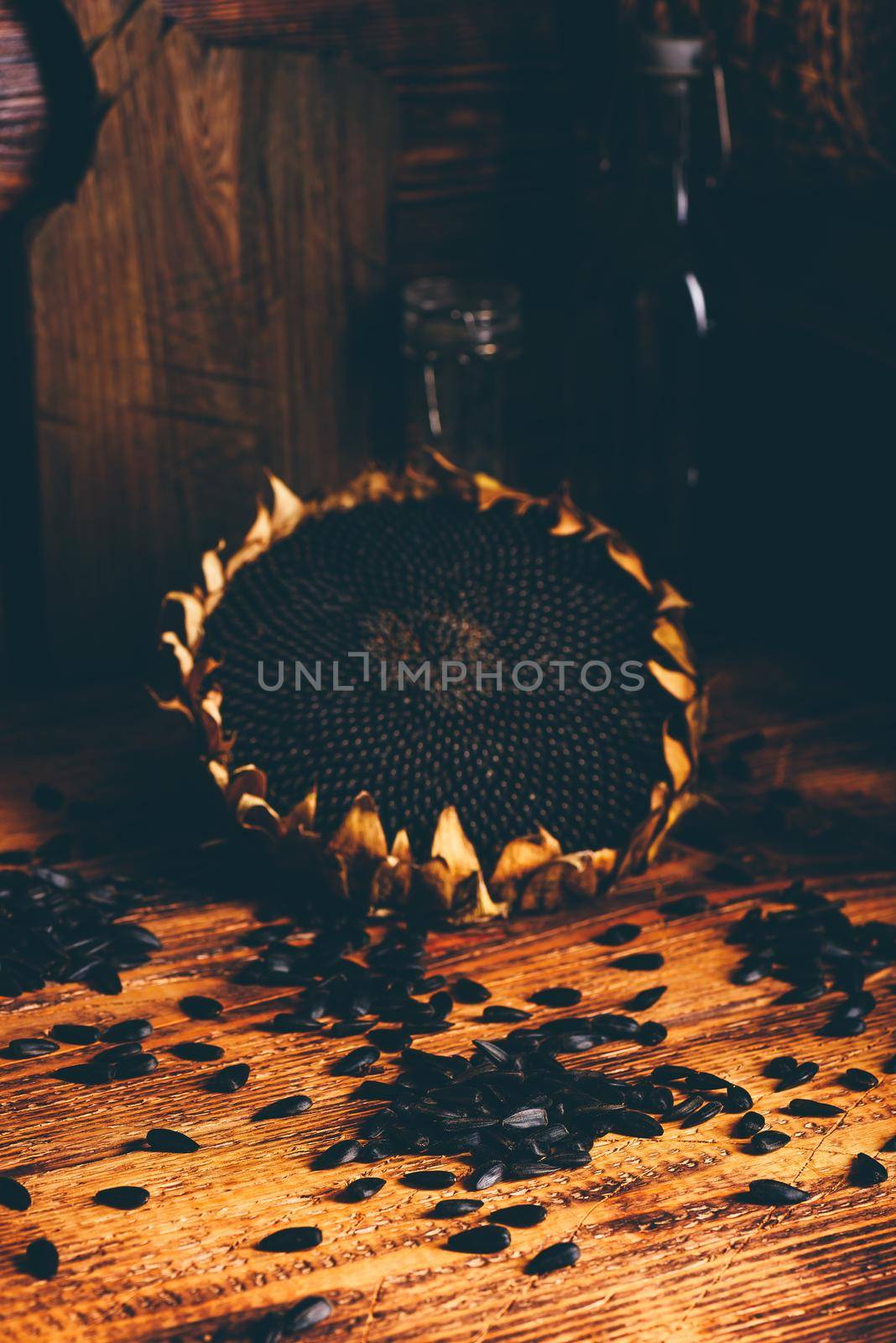 Dried sunflower and roasted seeds on the old wooden table