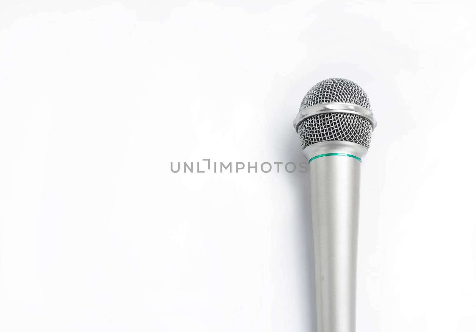 Silver microphone on white background.