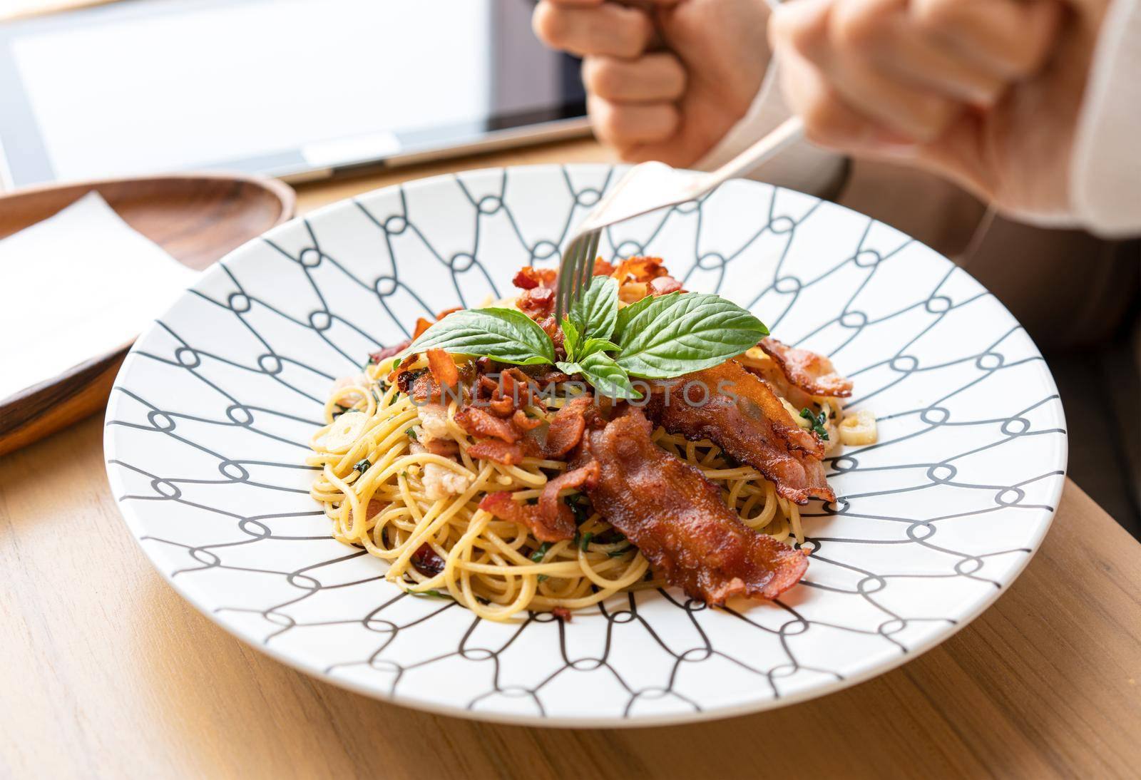 Spaghetti in a plate at a minimalist restaurant
