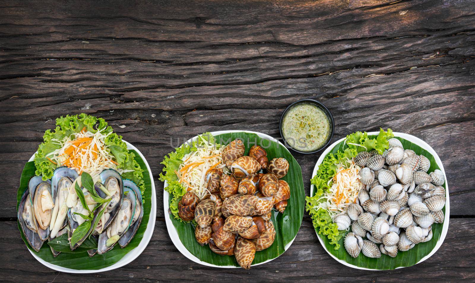 Seafood on a plate and ready to serve on wooden table