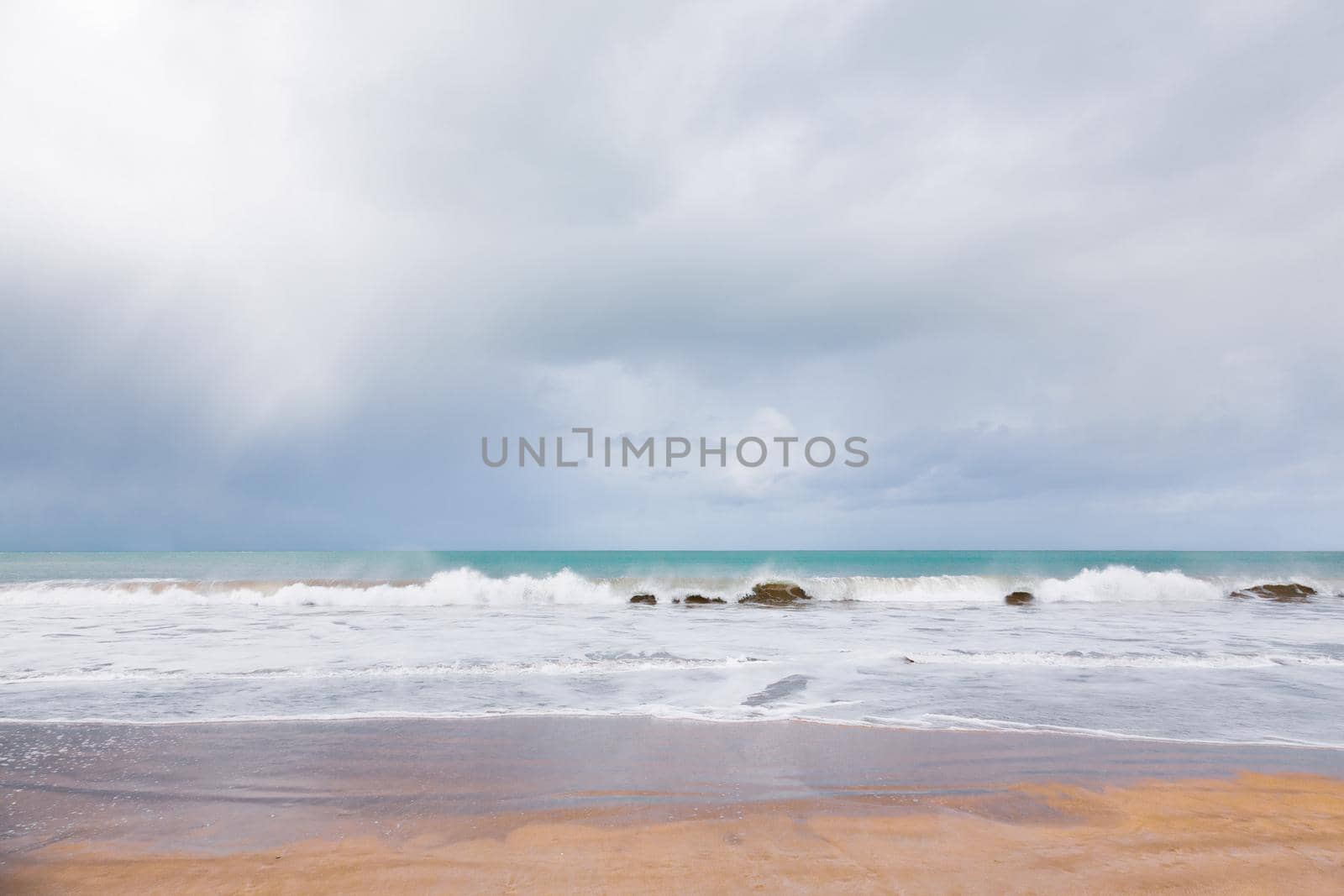 Empty beach and wave of the sea in Brittany, France