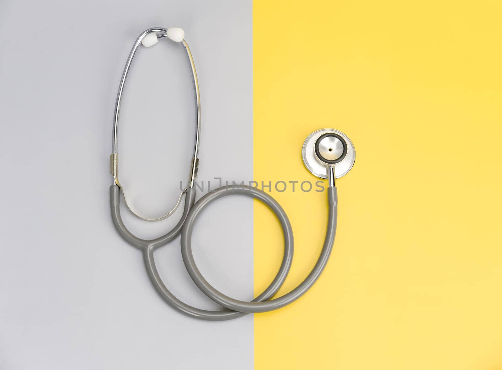 Stethoscope for doctor and copy space on color background