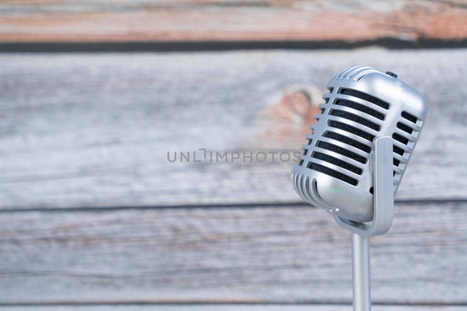 Microphone retro on wooden background by Buttus_casso