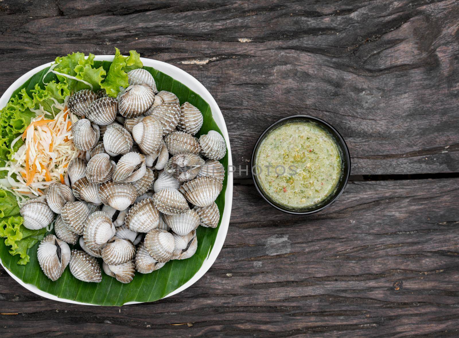 Seafood on a plate and ready to serve on wooden table