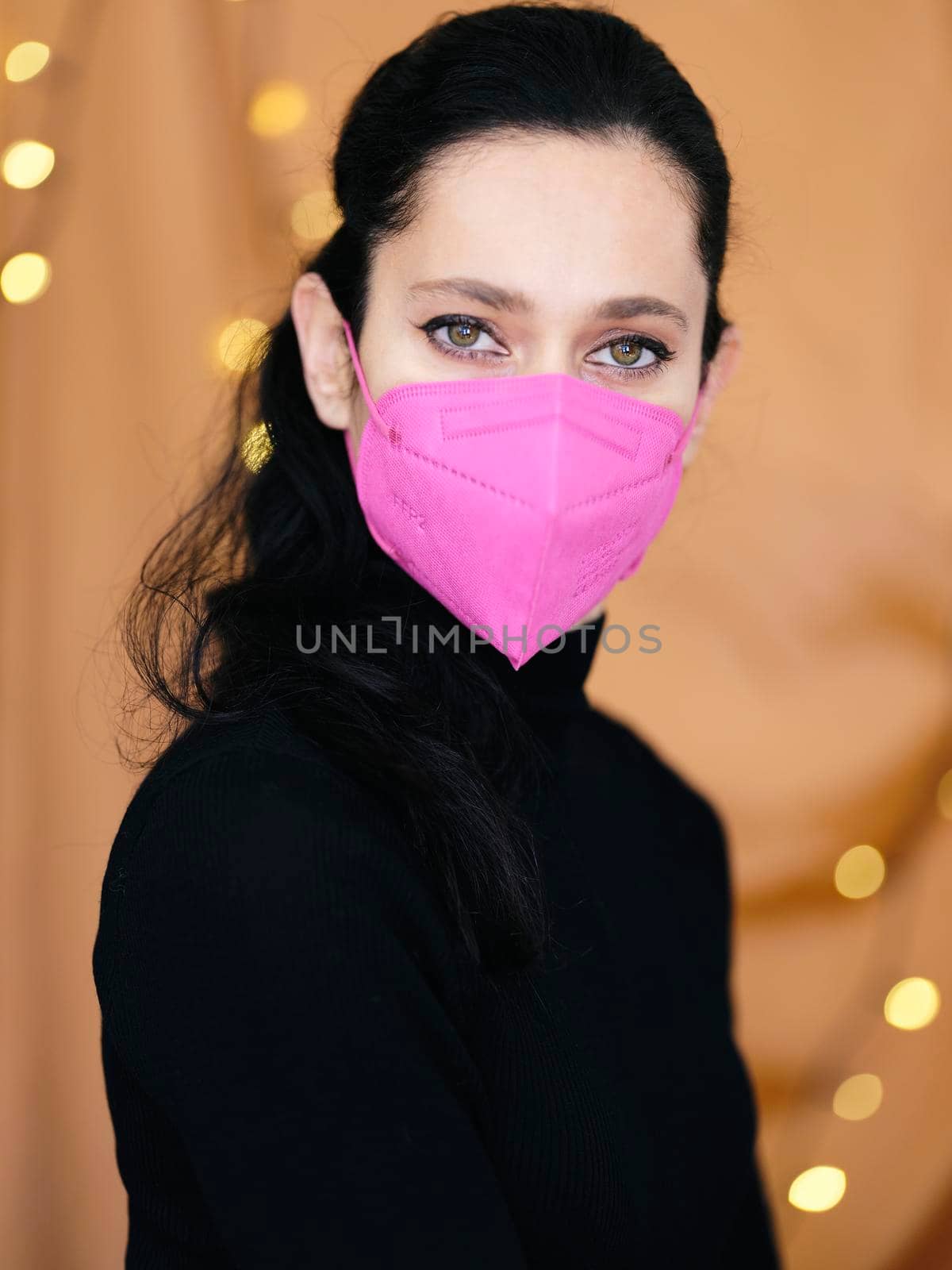 Portrait of young woman wearing protective mask KN95 FFP2 for spreading of disease virus SARS-CoV-2