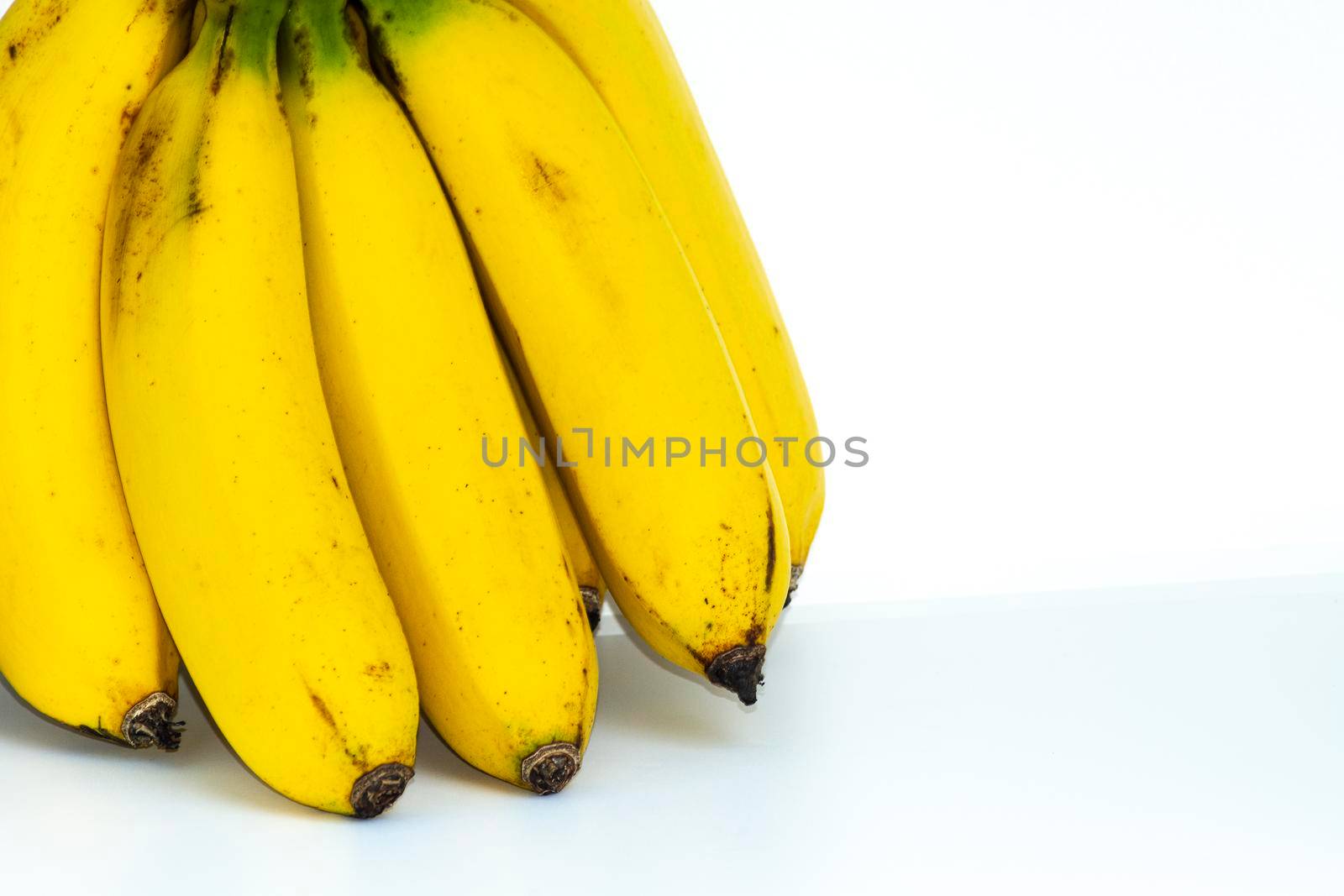 Bunch of bananas isolated on white background. Space for text