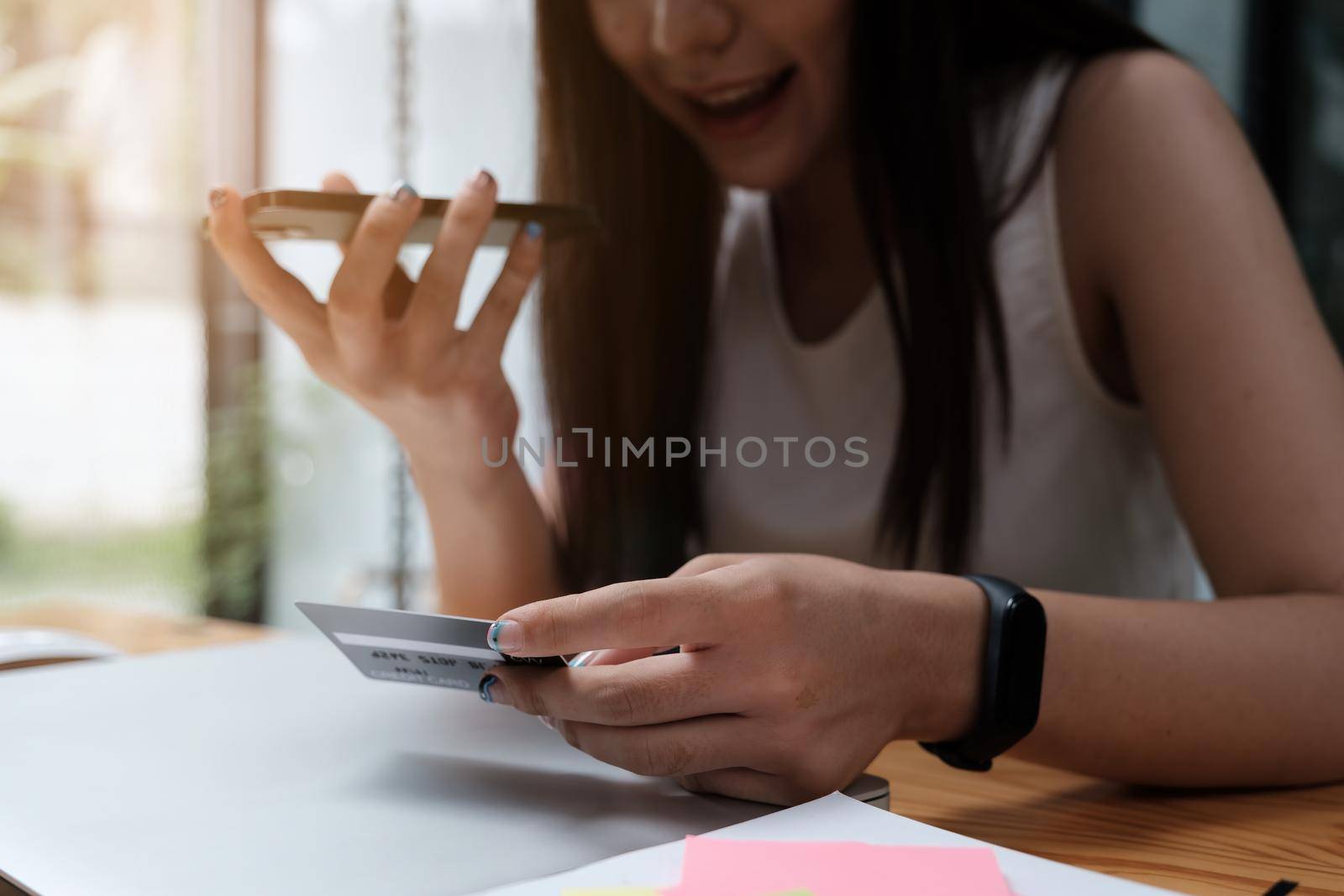 For an issue, a woman is speaking with a credit card contact center