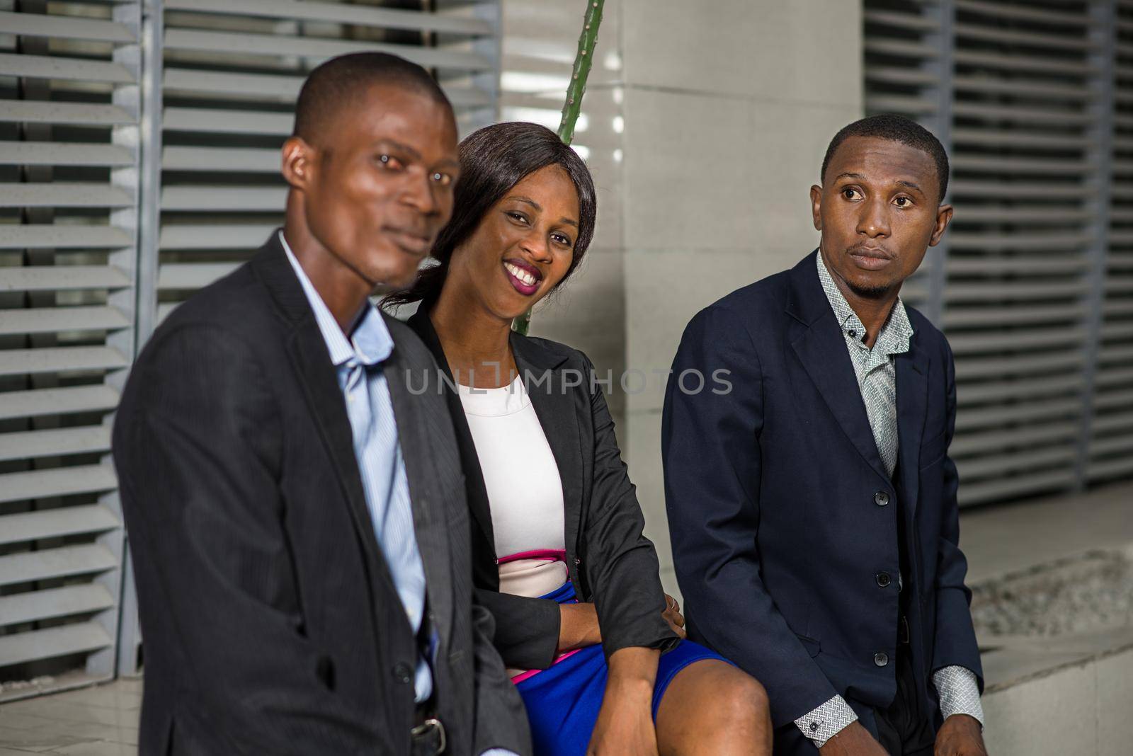small group of business people sitting in front of their office exchanging ideas.