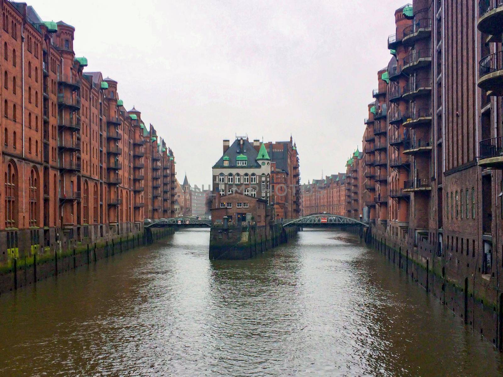 Hamburg landmark Wasserschloss. Old warehouses in Hafencity quarter in Hamburg. by kaliaevaen