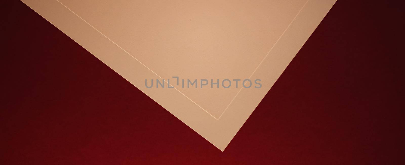 Blank A4 paper, beige on dark red background as office stationery flatlay, luxury branding flat lay and brand identity design for mockup by Anneleven
