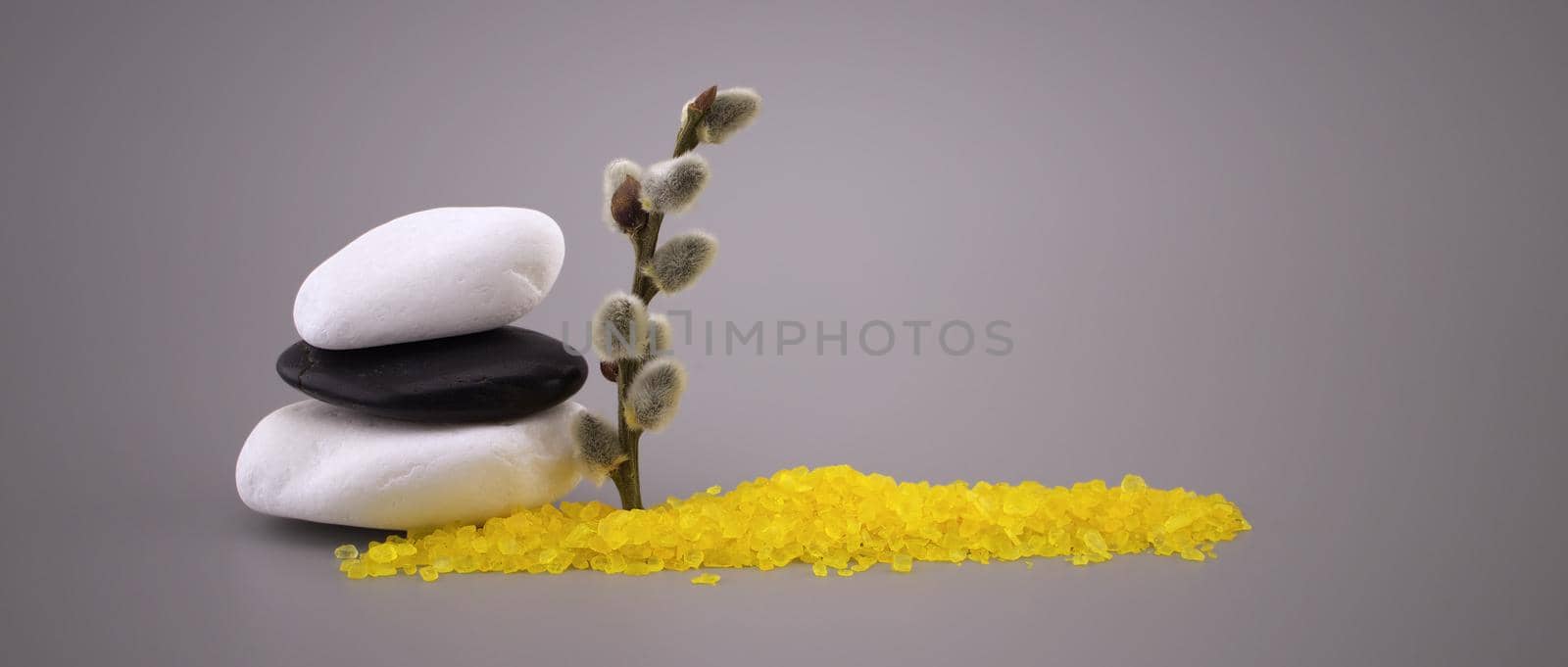 Zen still life with stacked stones, catkin and yellow crystals by NetPix