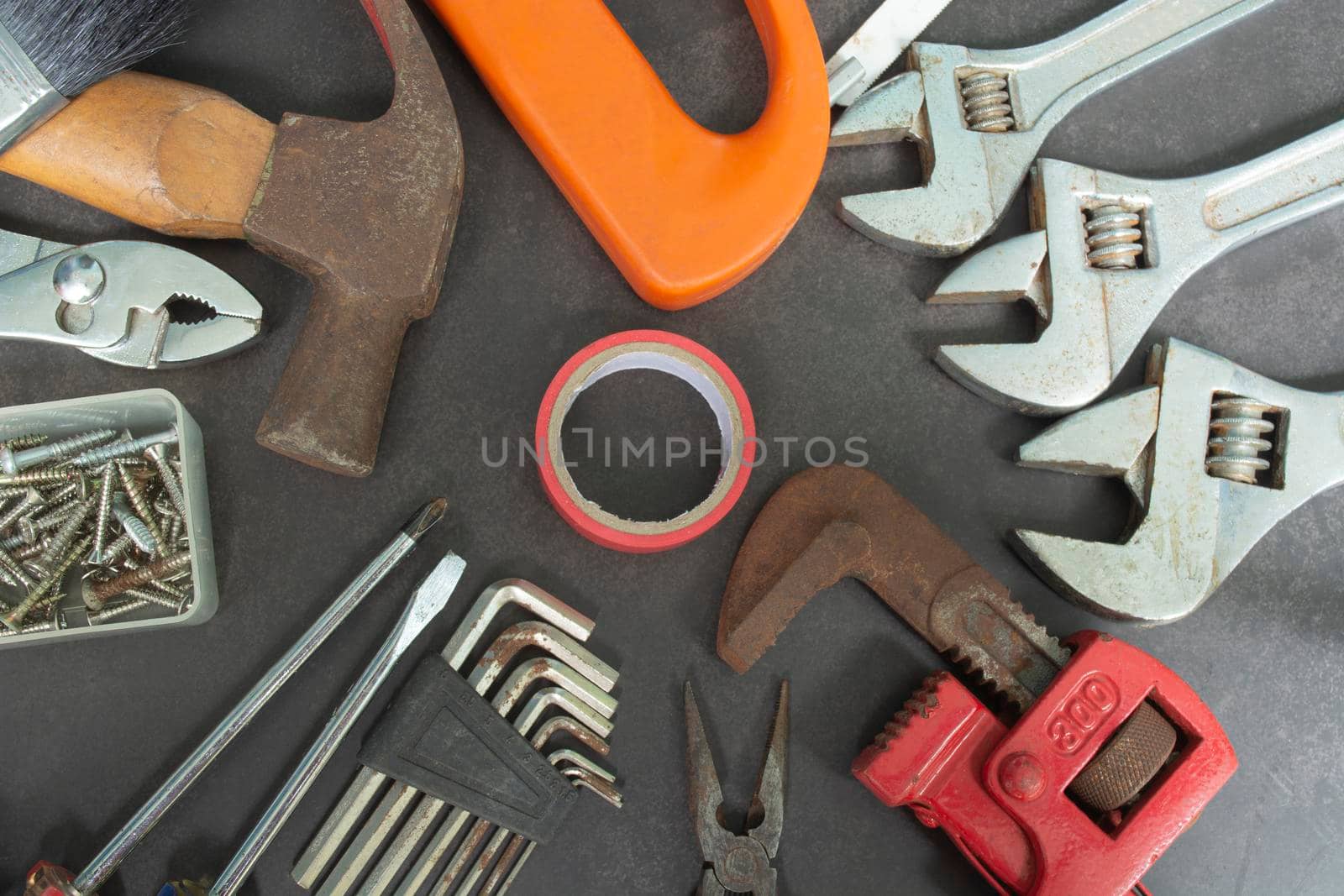 Repair equipment and many handy tools on a dark background. Labor day concept