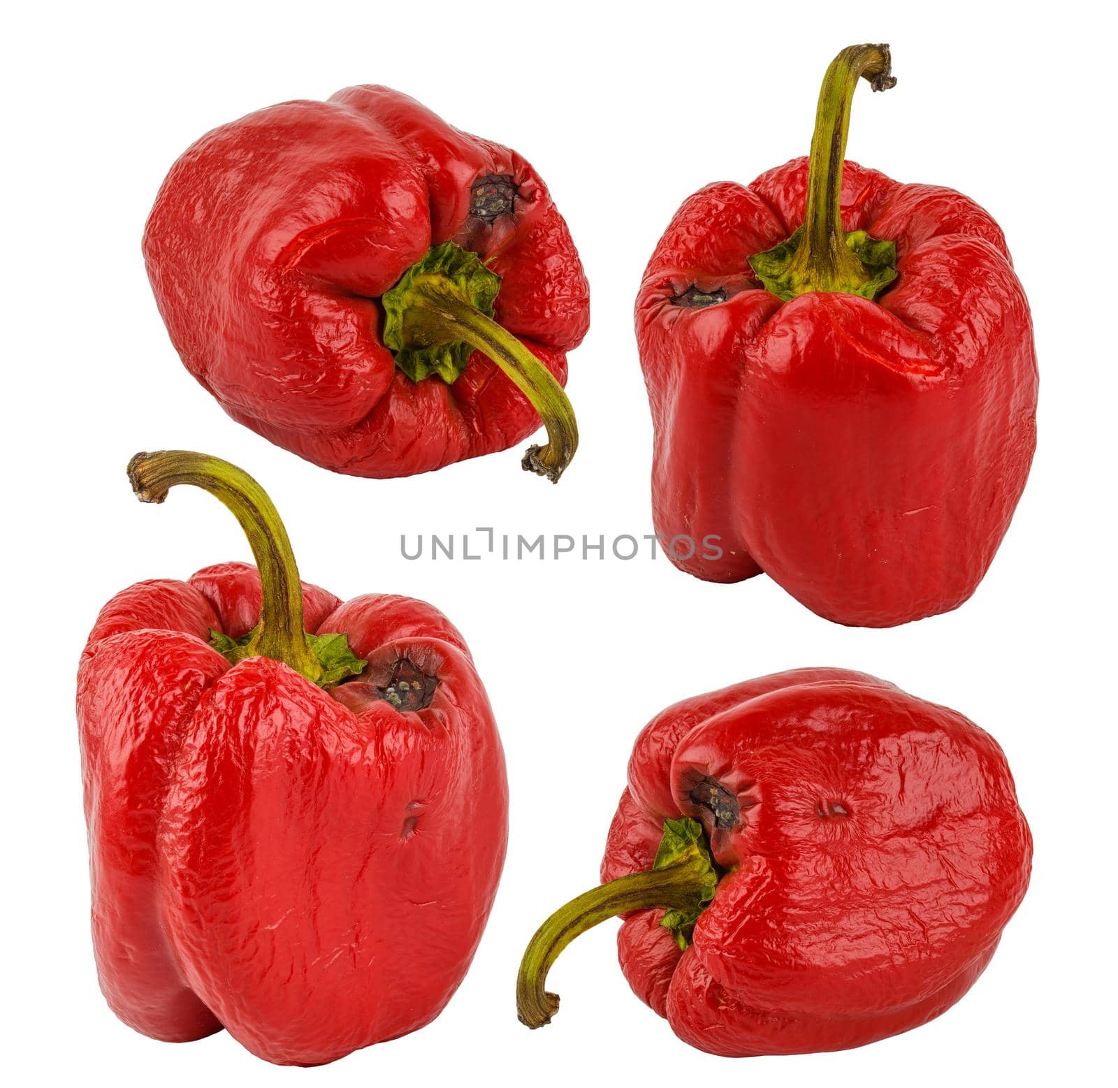 set of rotten red bell peppers isolated on white background.