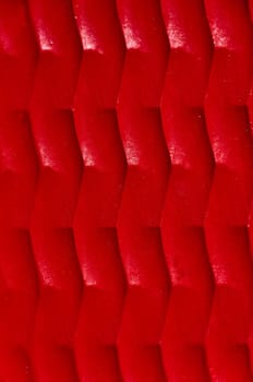 Red abstract background - imitation large matting, vertical view.