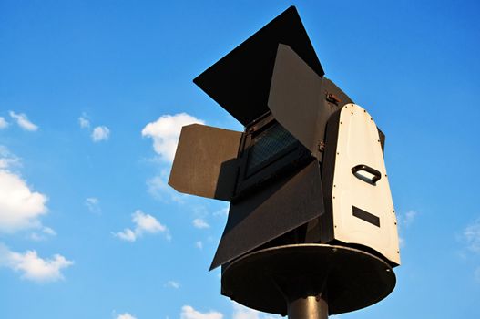 Architectural searchlight on a background of a blue sky.