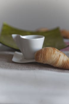 croissant and coffee cup at breakfast