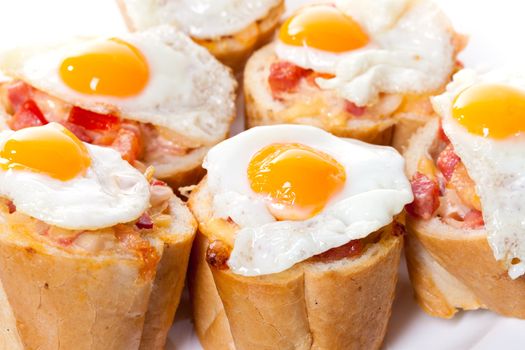 Baguette Slice with Ham and Fried Quail Egg, closeup