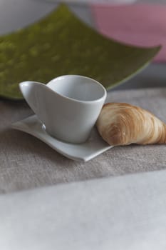 croissant and coffee cup at breakfast