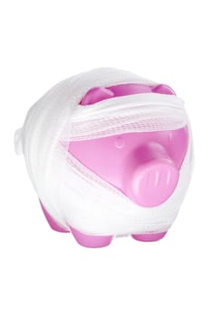 Piggy bank with bandage isolated on white background