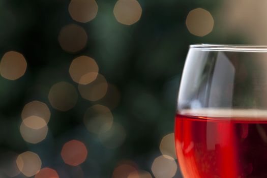 A glass of red wine on a holiday season 