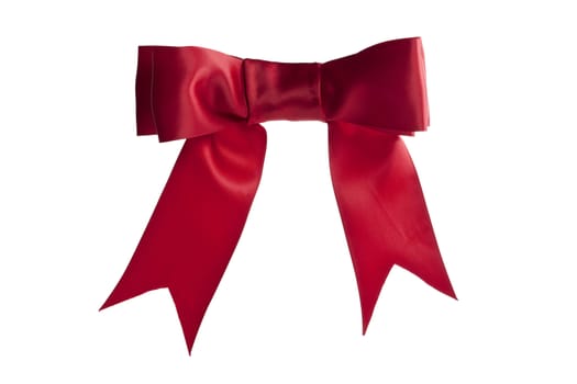A close-up image of a red bow ribbon over the white background