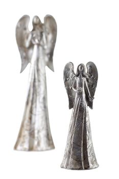 A close-up image of two silver angel figurine against the white background 