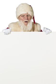 Santa clause hiding on the back of a white board