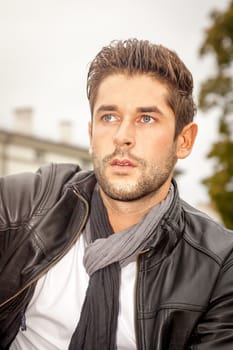 An image of a handsome young man in the autumn