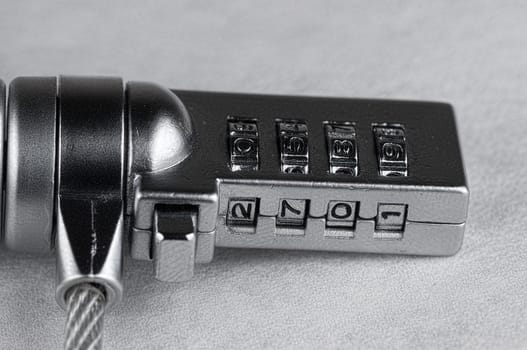 Metal laptop lock on white background close up detailed