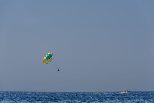 A summer sport - parasailing and boat