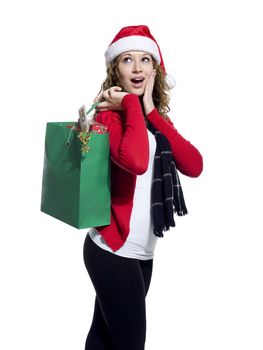 Side view of a surprised young woman holding shopping bag, Model: Brittany Beaudoin