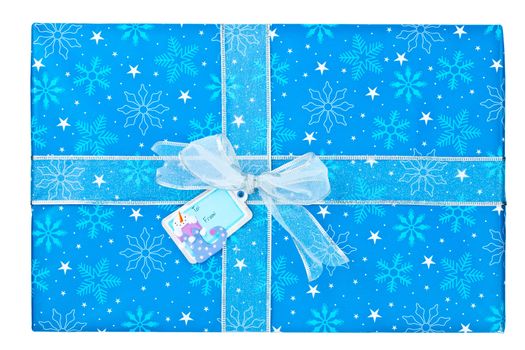 Close-up shot of blue Christmas gift box tied with ribbon and snowman sticker.