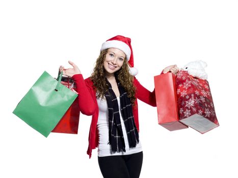 Portrait of a smiling young woman holding shopping bags against white background, Model: Brittany Beaudoin