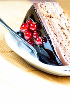slice of delicious chocolate cake with fresh berry