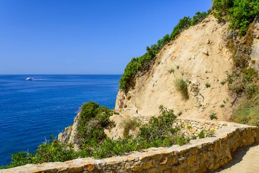 View on sea boat and walkway at Costa Brava