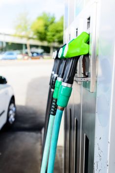 Gas pump nozzles at gas pump