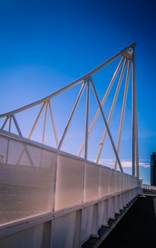 Modern bridge pylon against a blue sky