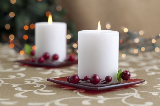 A horizontal image of dinner table with two lighted candle