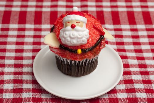 Santa claus cupcake in a white plate