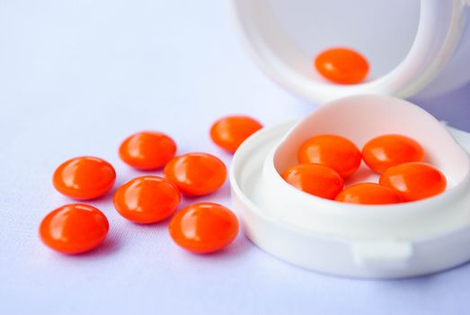 pills an pill bottle on white background