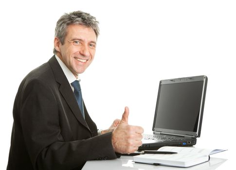 Senior business man working on laptop. Isolated on white