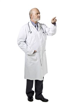 Portrait of a male doctor wearing medical suit pointing to the side of a white background 
