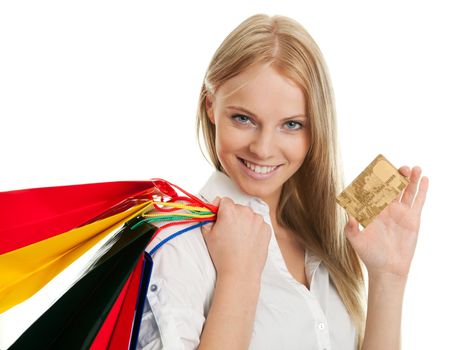 Beautilful young woman carrying shopping bags. Isolated on white