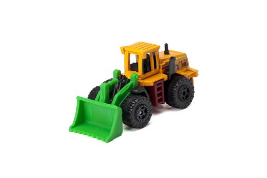Close up image of bulldozer toy truck against white background