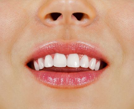 Healthy woman teeth and smile. Close up.