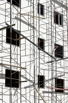 Low angle shot of steel frames of a building under construction.