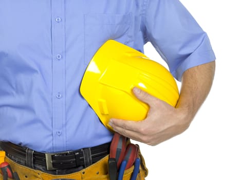 A close-up portrait of a worker on blue polo with construction tools and yellow hard hat 