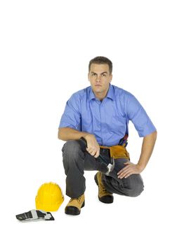 Portrait of handsome architect with hammer and hardhat over white background